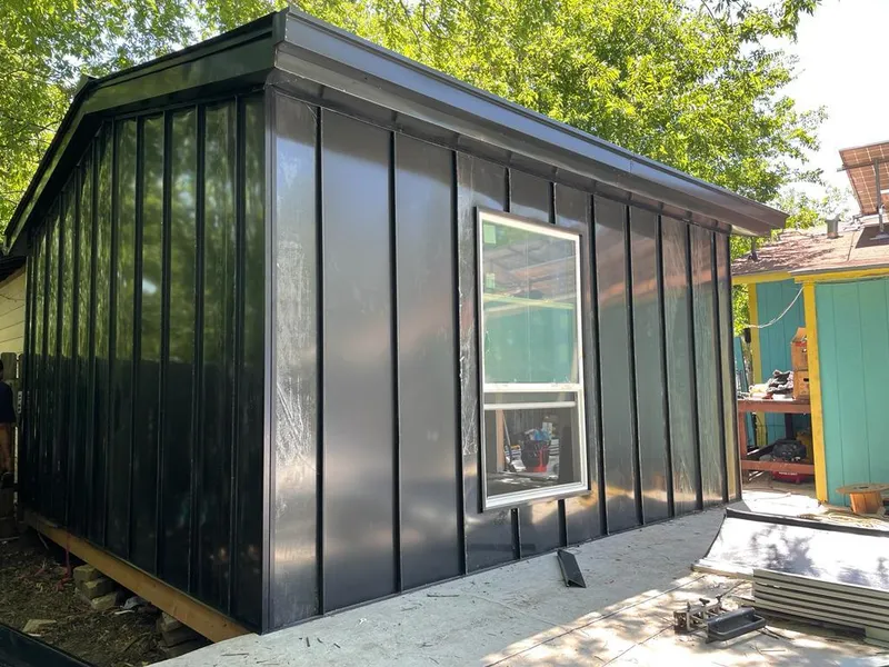 Black standing seam metal wall panels for Metal Roof Installation in Heeia