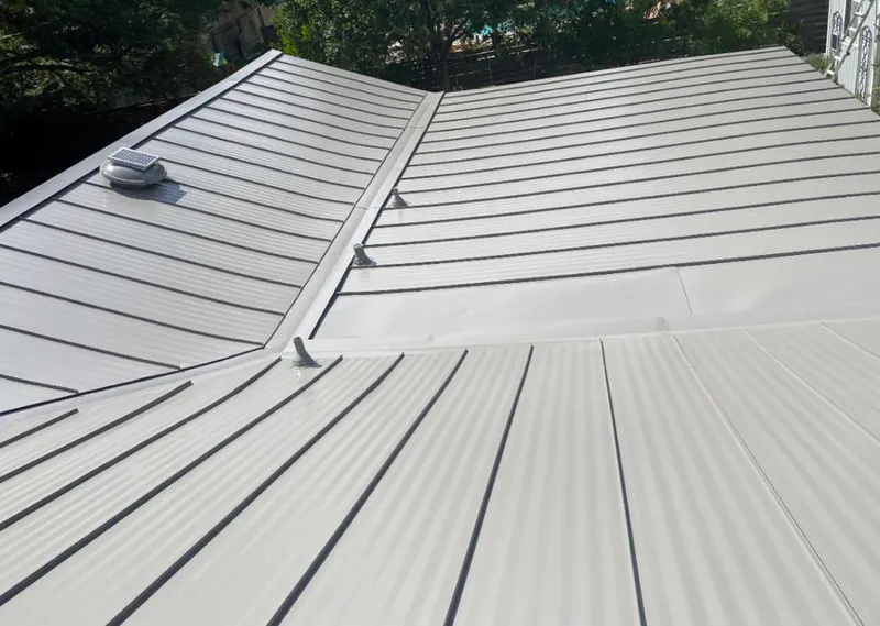 Solar attic fan installed on a metal roof for Roof Ventilation in Heeia